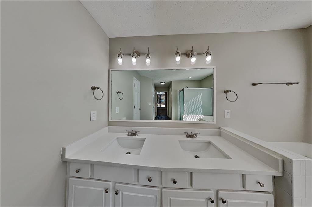 2097 Corsica Way Southwest Marietta, GA 30008 - Photo 10 of 25 a bathroom with a sink vanity and mirror