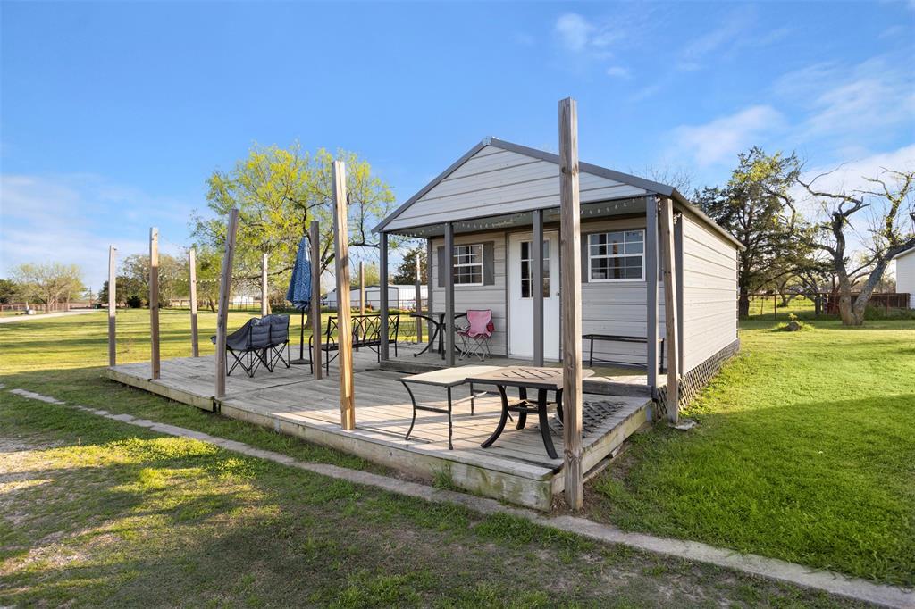 6524 Fair Road Kaufman, TX 75142 - Photo 28 of 30 a view of a house with a yard and furniture