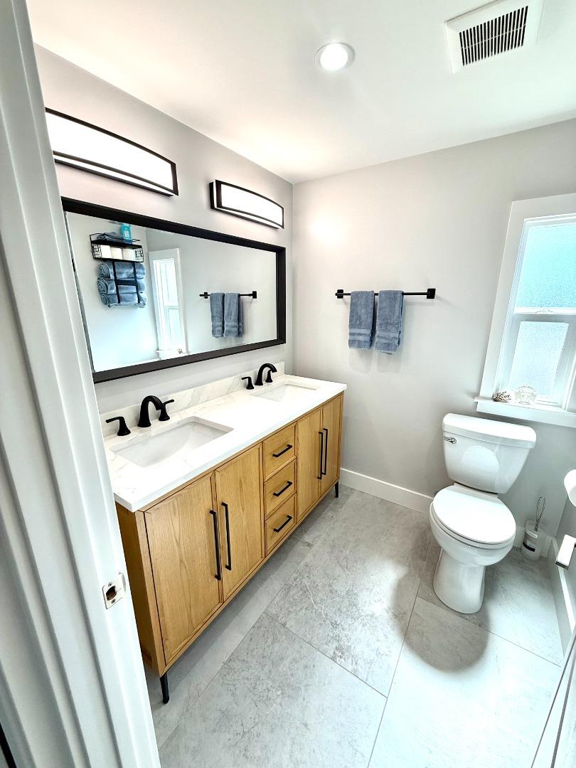 8 Lighthouse Road, Unit 8 Half Moon Bay, CA 94019 - Photo 8 of 21 a bathroom with a sink a toilet and mirror