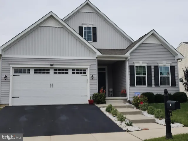front view of a house with a small yard