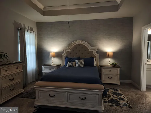 a bathroom with a double vanity sink mirror and toilet