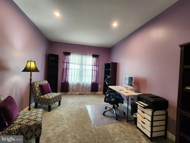 a bedroom with bed and window