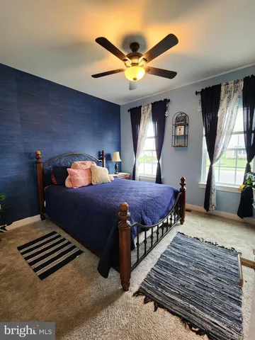 a bathroom with a double vanity sink toilet and shower