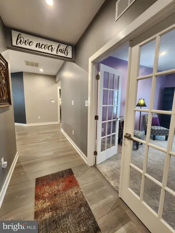 a view of a house with a yard and porch