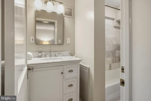 a bathroom with a sink and a bathtub