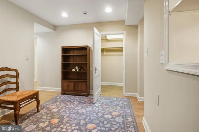 a view of a livingroom with wooden floor and a window