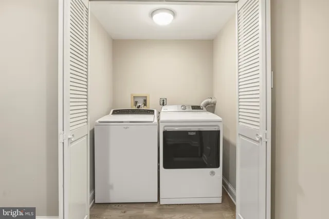 a view of a brick house with many windows