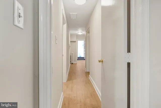 a view of a hallway with a white walls