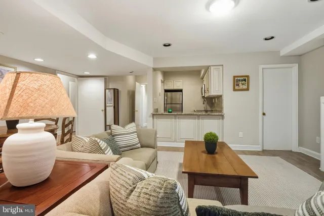 a kitchen with cabinets stainless steel appliances and a sink