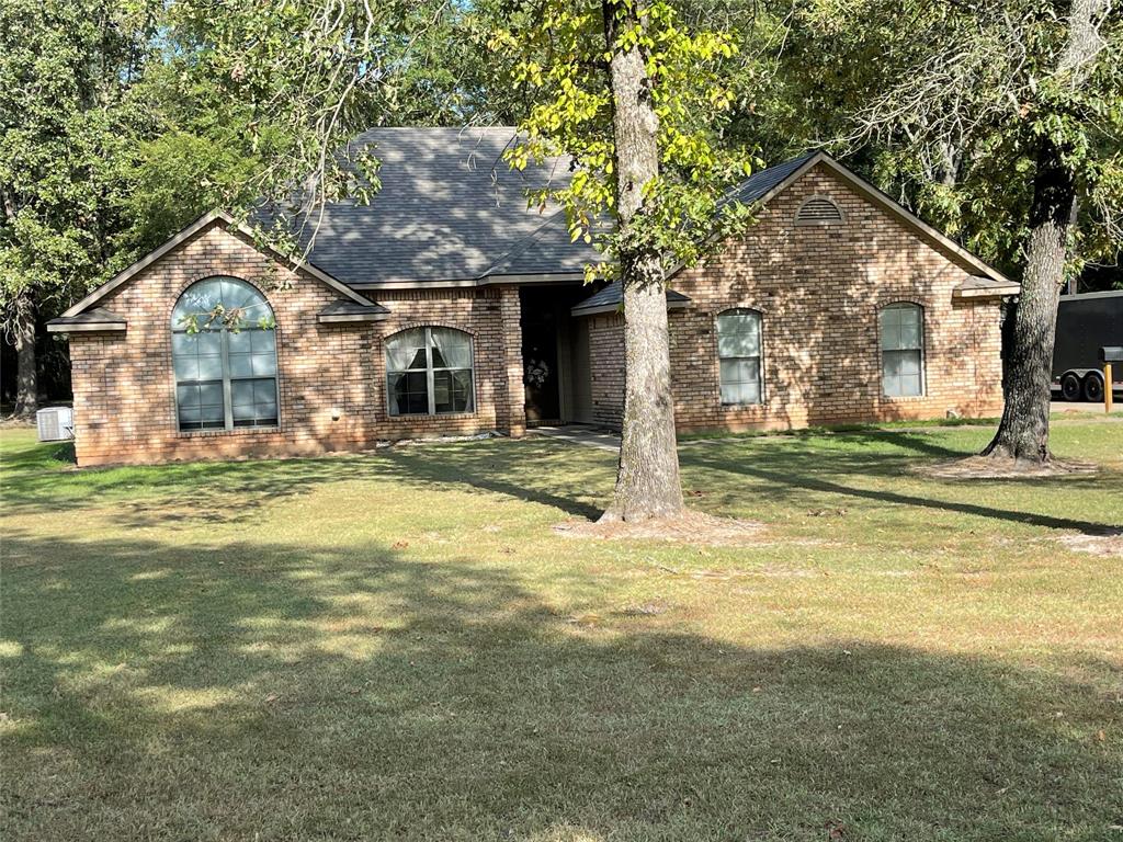 1035 Crouch Road Benton, LA 71006 - Photo 1 of 9 Brick exterior residence with a partial gable roof and arched window detailing