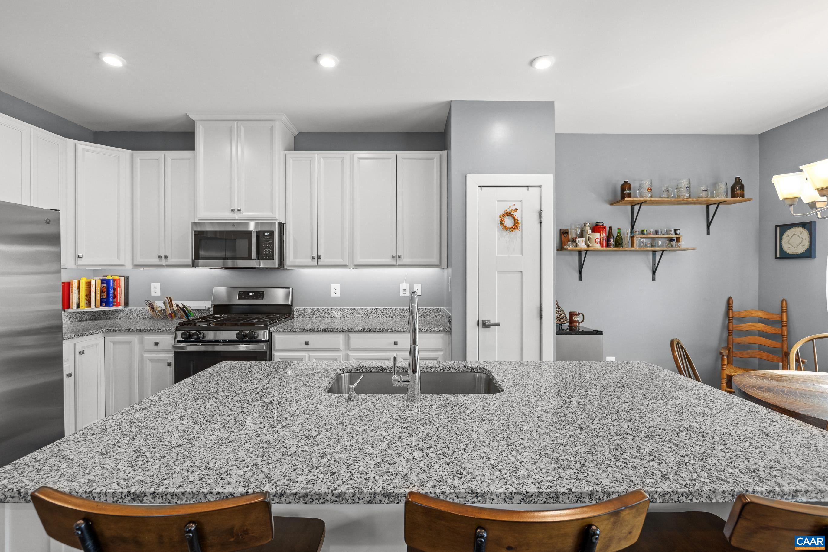 4286 Sunset Drive Charlottesville, VA 22911 - Photo 11 of 43 a kitchen with stainless steel appliances granite countertop a sink refrigerator and stove