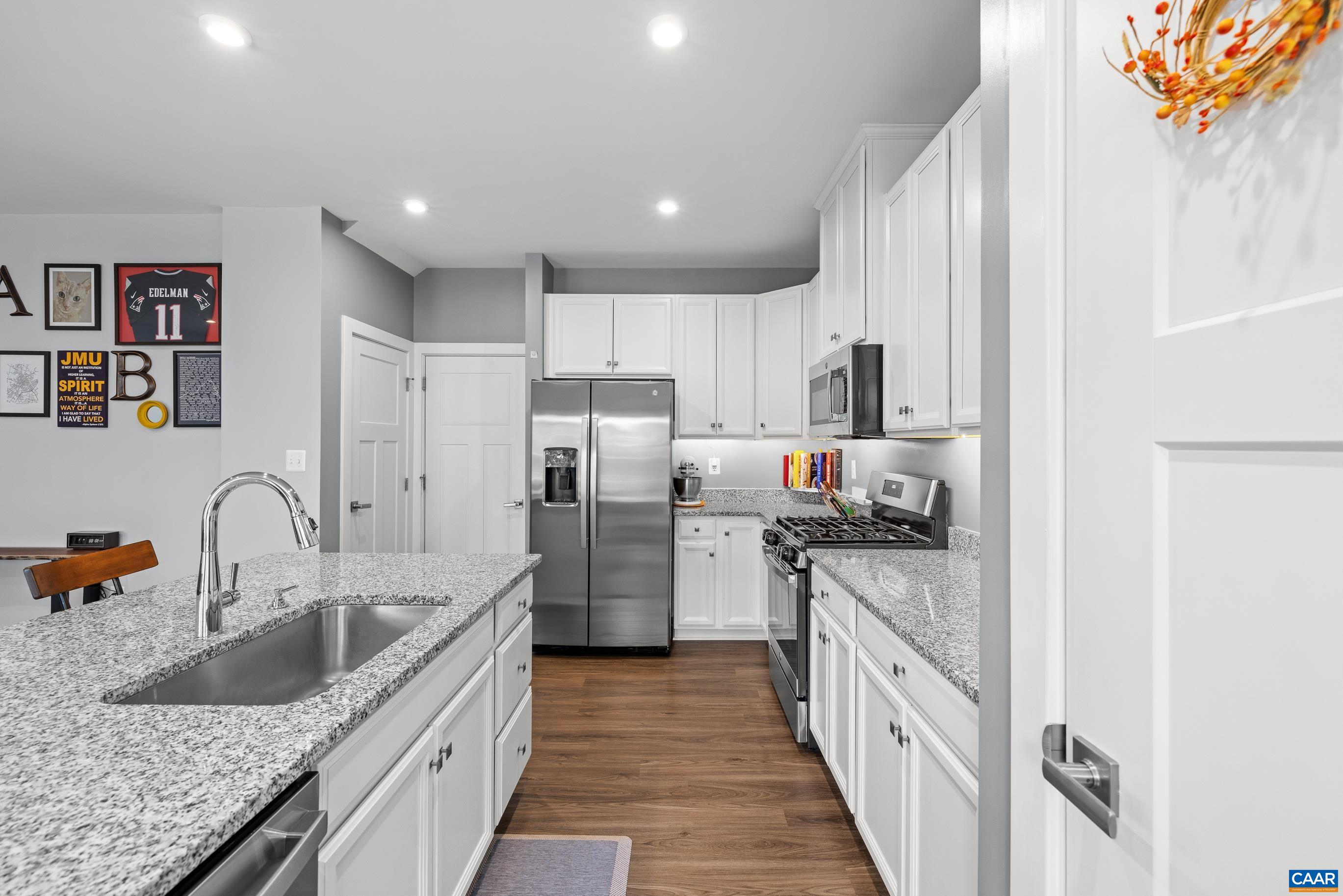 4286 Sunset Drive Charlottesville, VA 22911 - Photo 12 of 43 a kitchen with refrigerator a stove and a sink