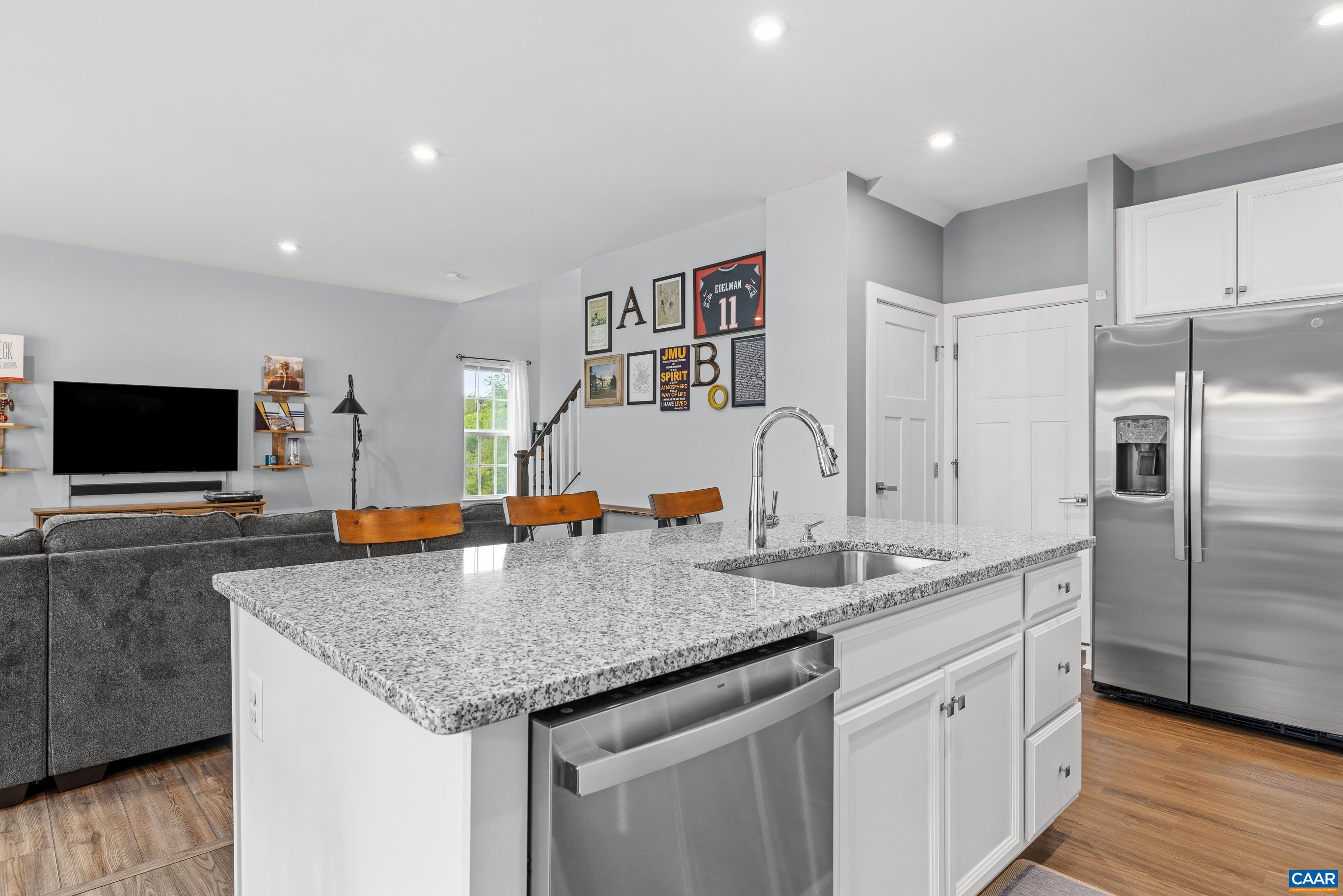 4286 Sunset Drive Charlottesville, VA 22911 - Photo 13 of 43 a kitchen with granite countertop a center island and stainless steel appliances