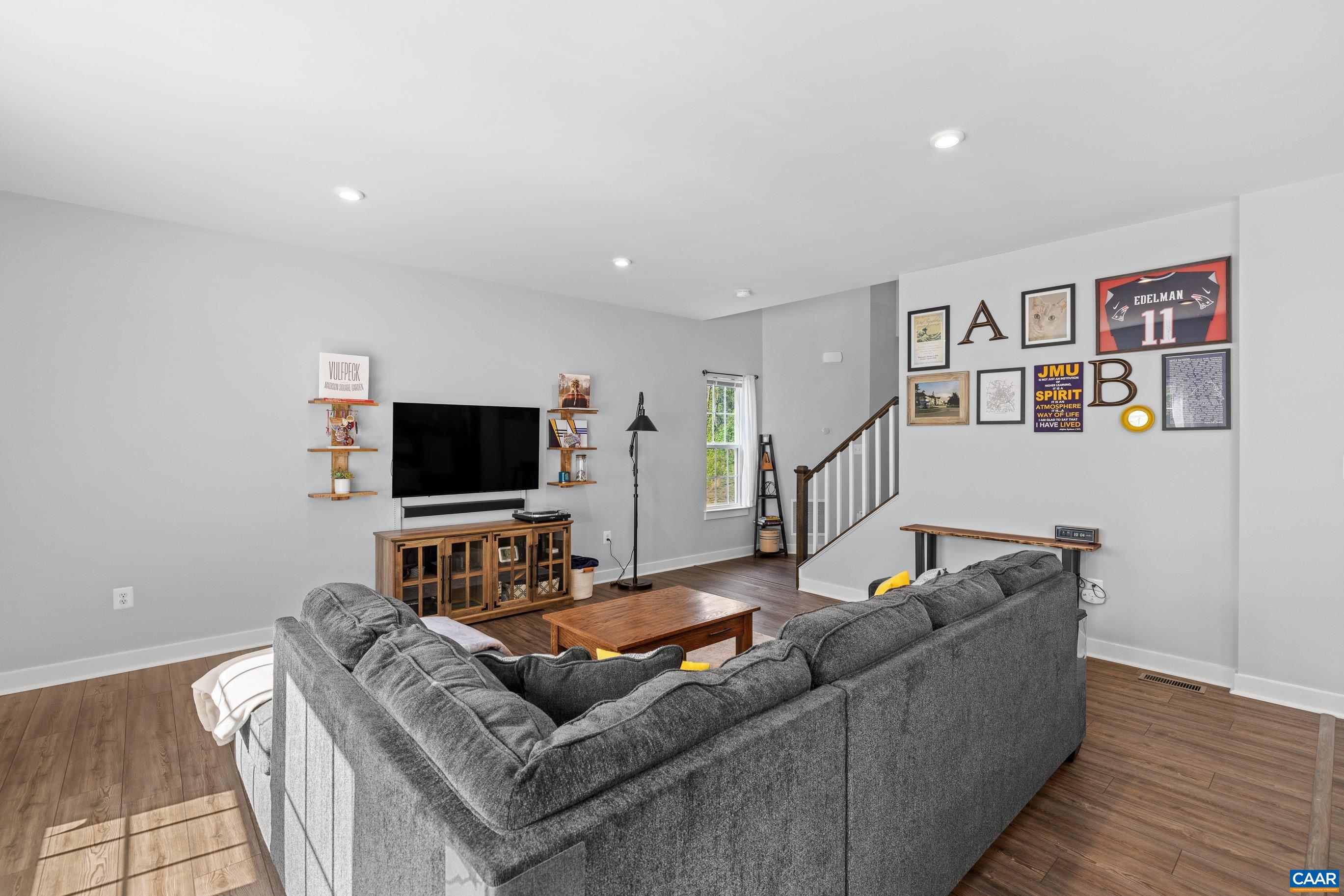 4286 Sunset Drive Charlottesville, VA 22911 - Photo 15 of 43 a living room with furniture and a flat screen tv