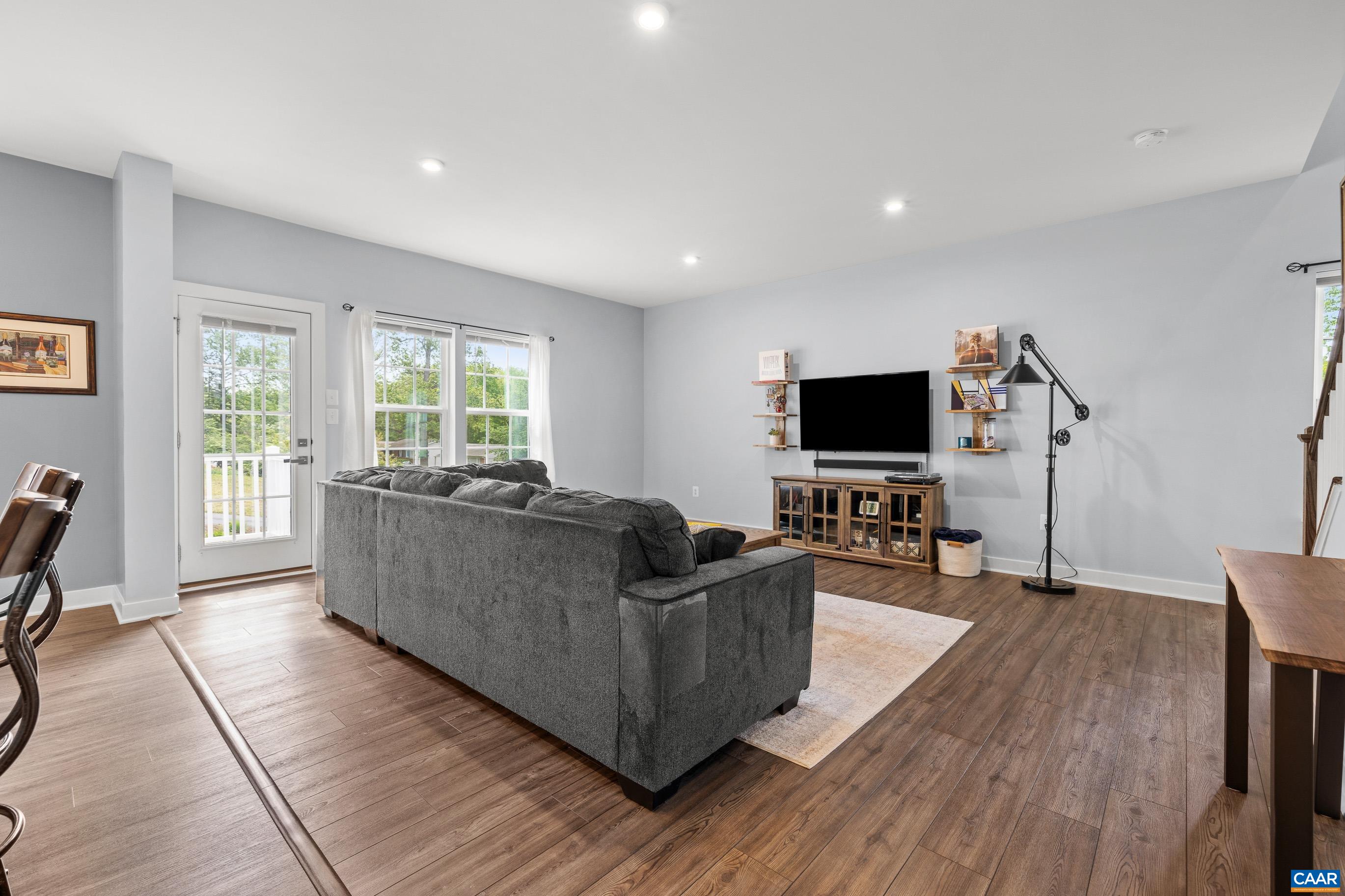 4286 Sunset Drive Charlottesville, VA 22911 - Photo 16 of 43 a living room with furniture and a flat screen tv