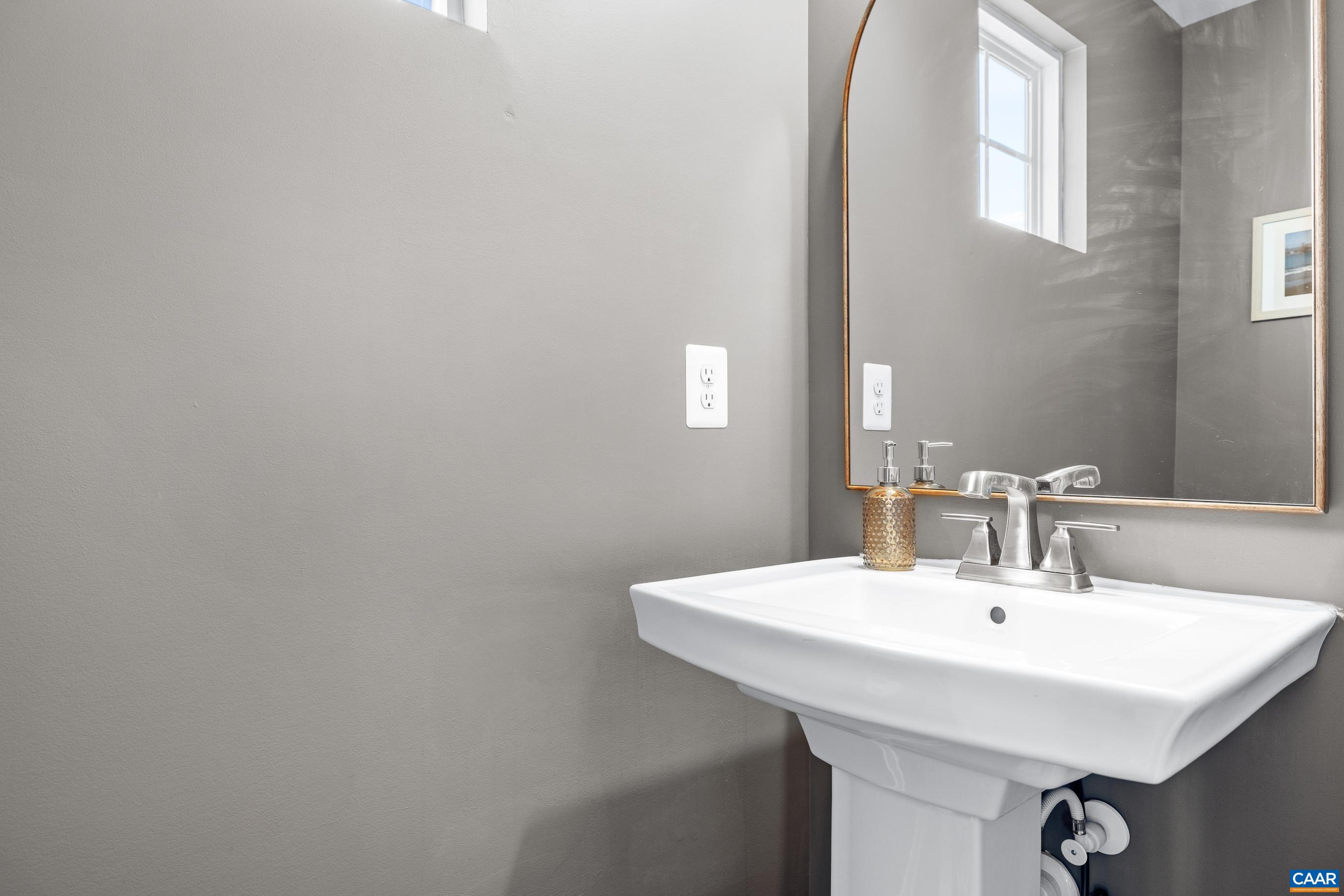 4286 Sunset Drive Charlottesville, VA 22911 - Photo 17 of 43 a bathroom with a sink and a mirror