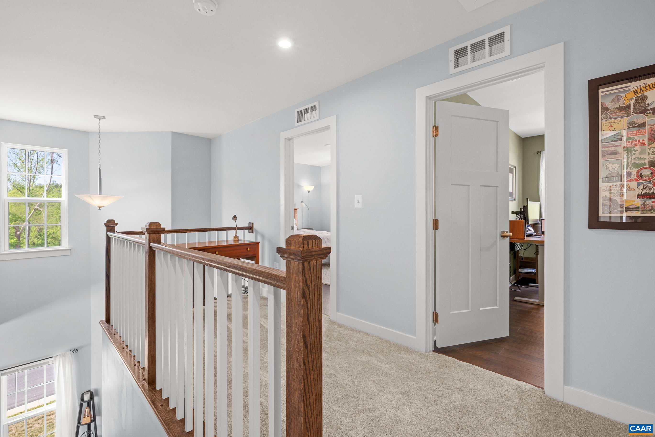 4286 Sunset Drive Charlottesville, VA 22911 - Photo 20 of 43 a view of a hallway with windows and stairs