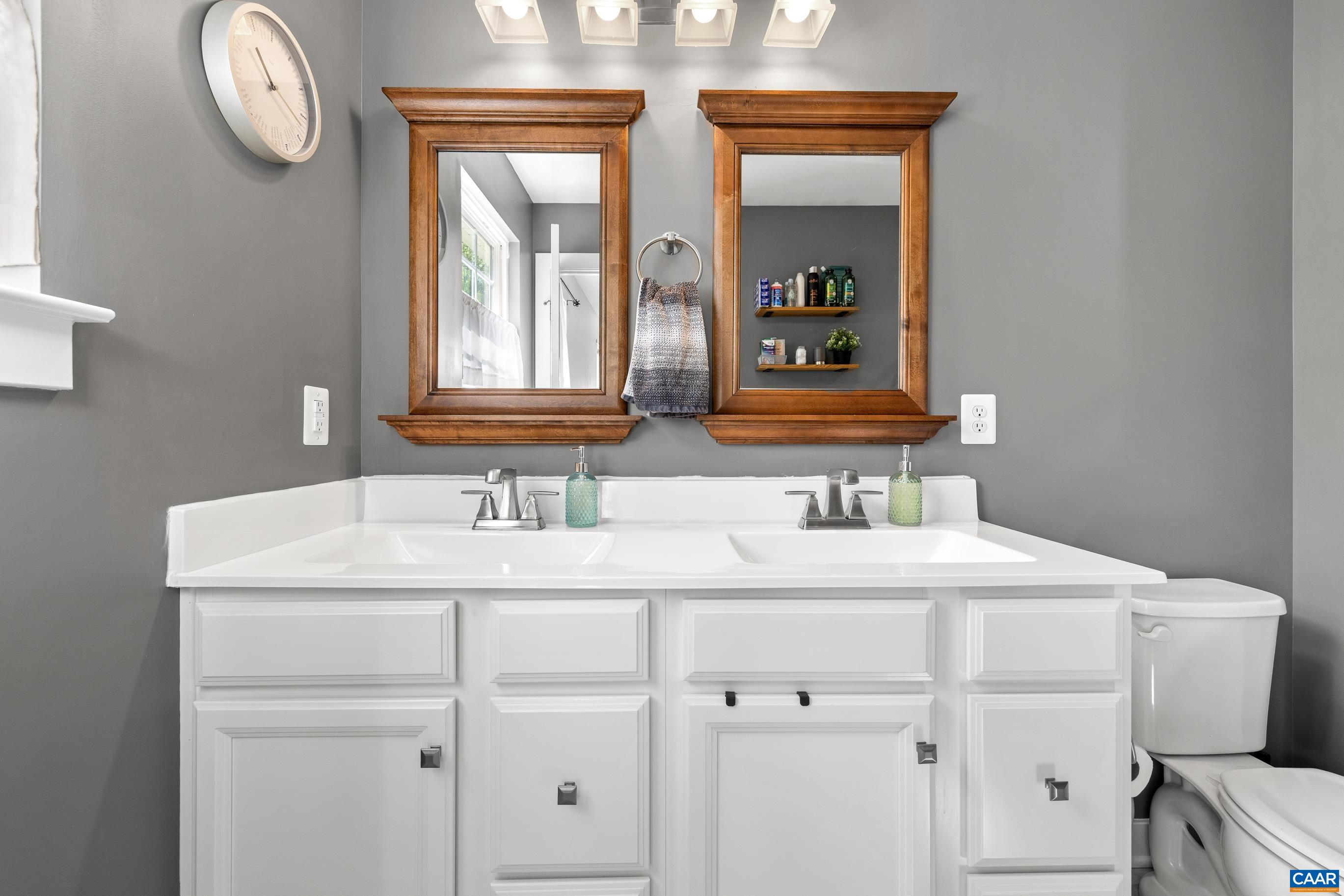 4286 Sunset Drive Charlottesville, VA 22911 - Photo 24 of 43 a bathroom with a sink and a mirror