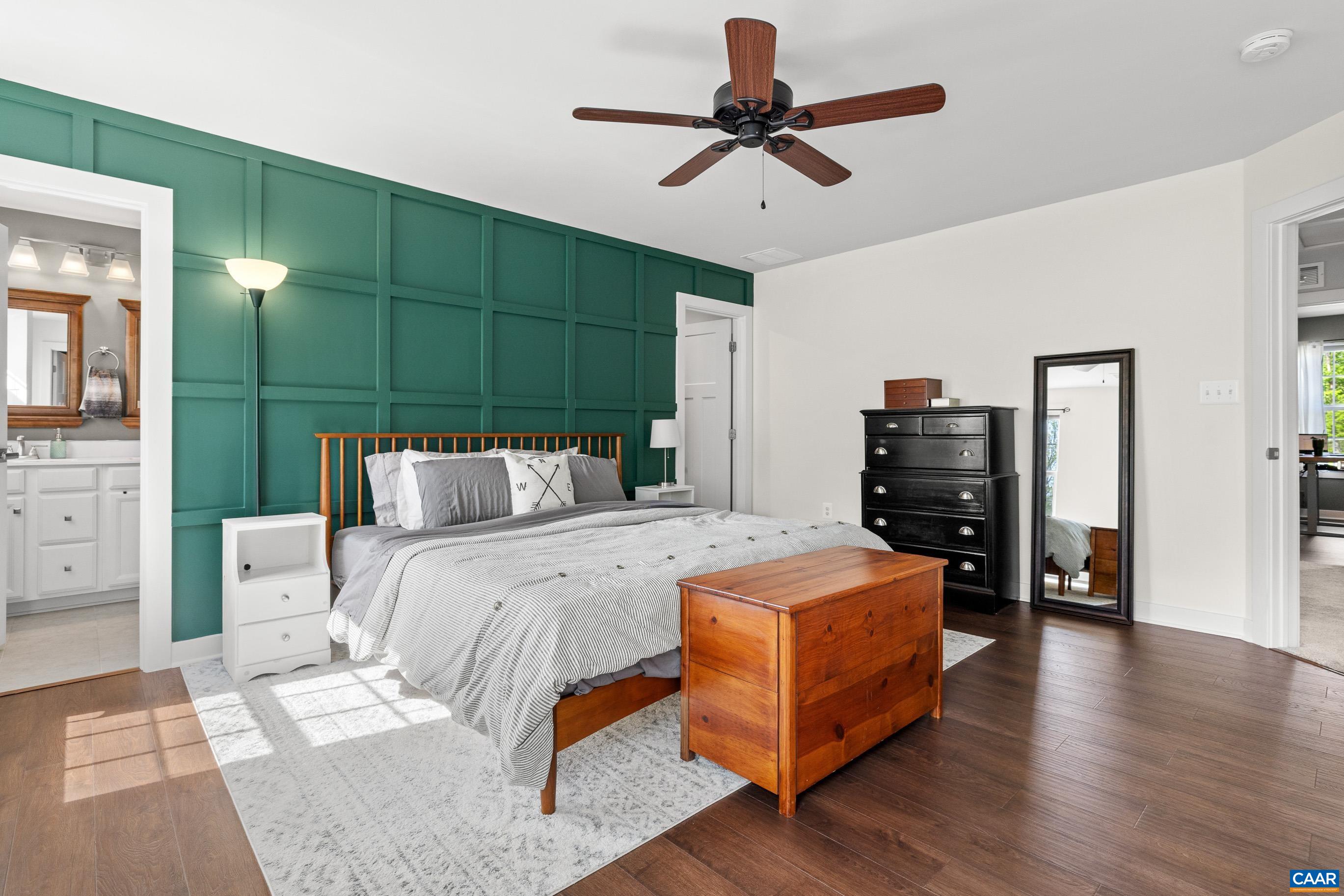 4286 Sunset Drive Charlottesville, VA 22911 - Photo 4 of 43 a bedroom with a bed and a chandelier