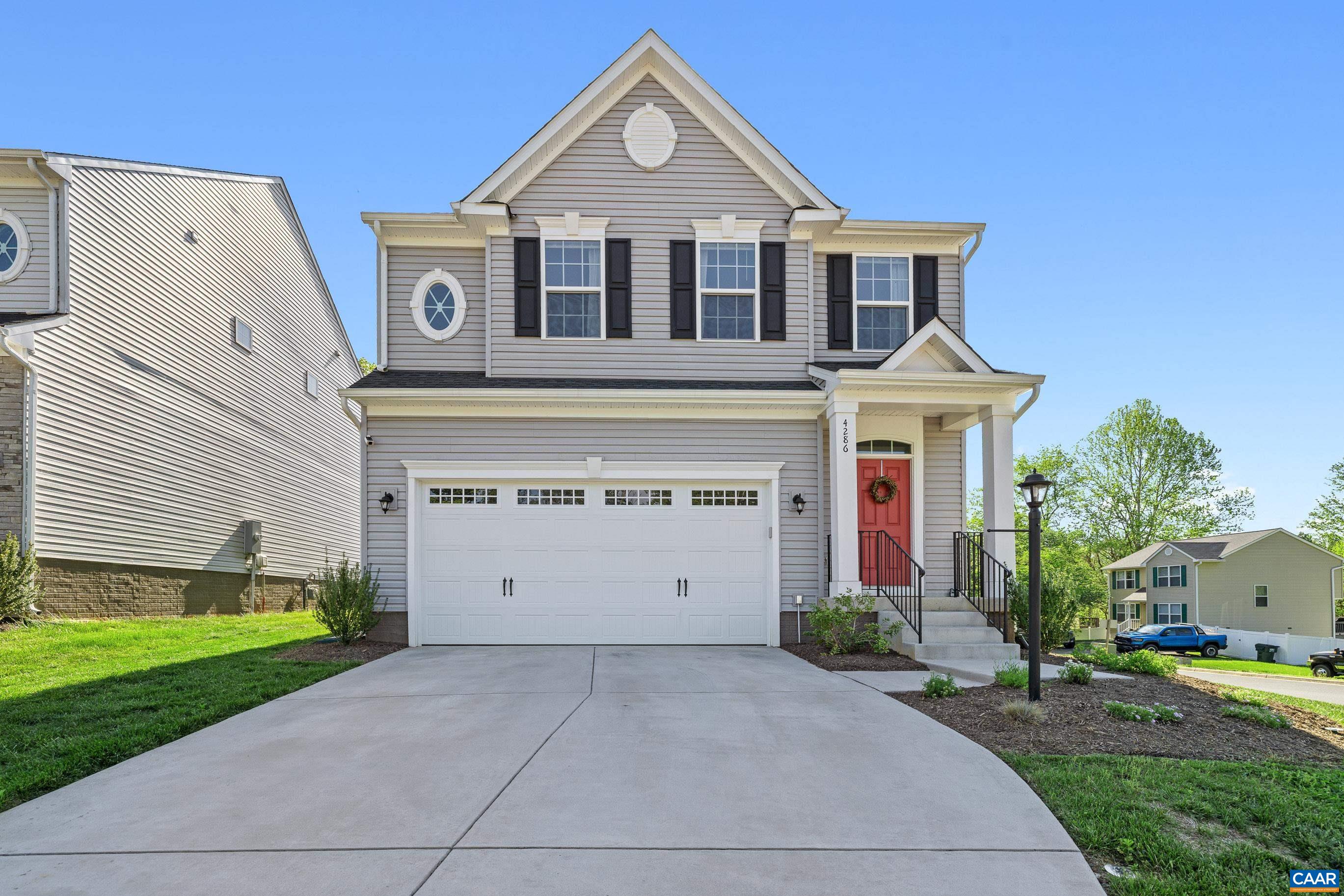 4286 Sunset Drive Charlottesville, VA 22911 - Photo 41 of 43 a front view of a house with a yard and garage
