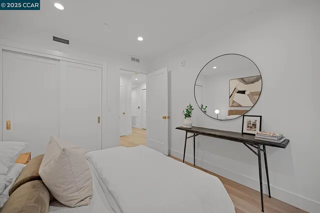 a bedroom with a bed and couch