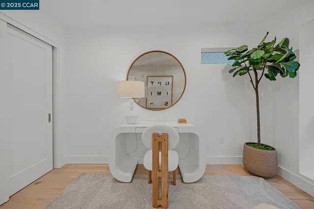 a bathroom with a toilet a sink and a mirror