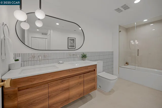 a spacious bedroom with a bed and a couch