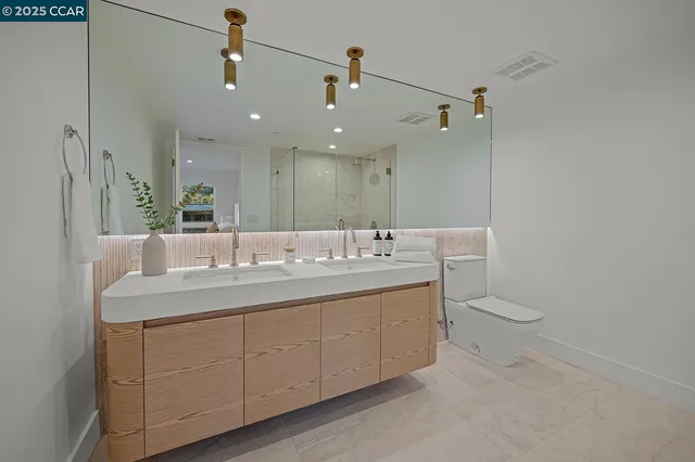 a kitchen with sink a stove and refrigerator