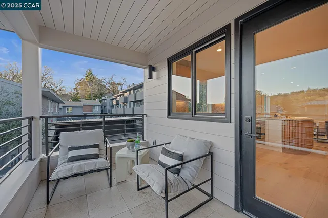 a aerial view of a house with swimming pool and sitting area