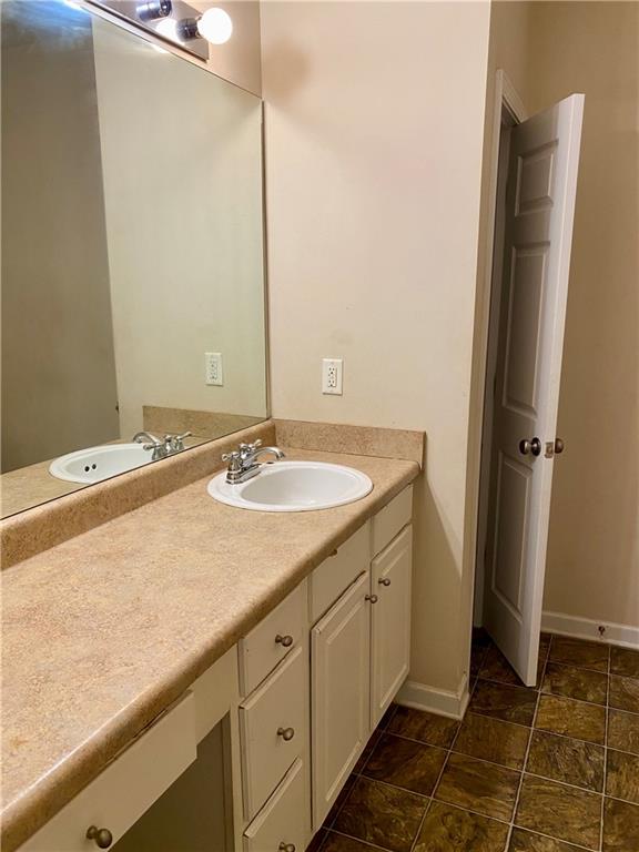 1428 Orchard Park Drive Stone Mountain, GA 30083 - Photo 12 of 19 a bathroom with a sink and a mirror