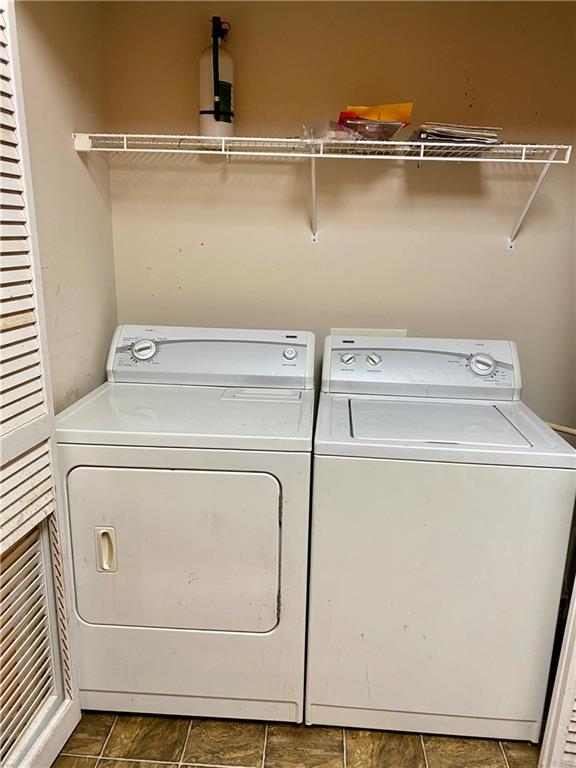 1428 Orchard Park Drive Stone Mountain, GA 30083 - Photo 15 of 19 a utility room with dryer and washer