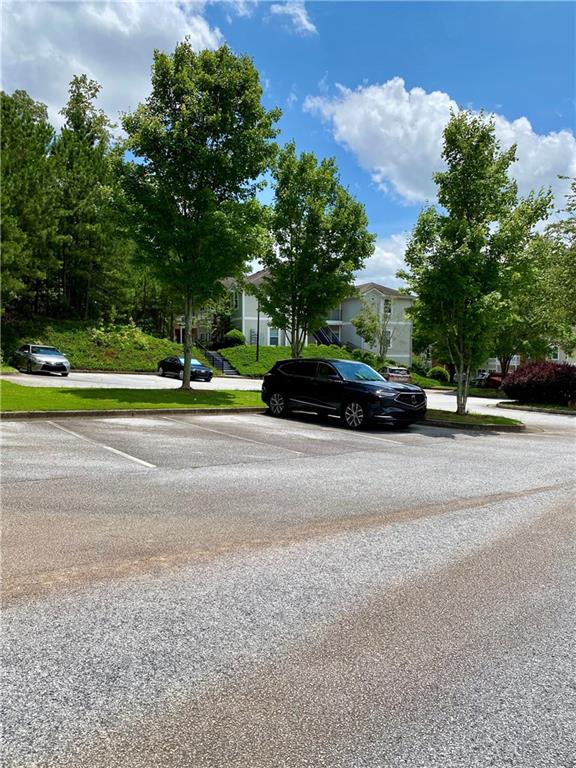 1428 Orchard Park Drive Stone Mountain, GA 30083 - Photo 19 of 19 a car parked on the side of the road