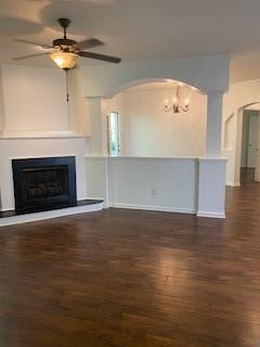 1428 Orchard Park Drive Stone Mountain, GA 30083 - Photo 7 of 19 a view of an empty room with wooden floor fireplace and a window