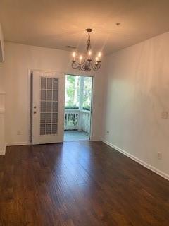 1428 Orchard Park Drive Stone Mountain, GA 30083 - Photo 9 of 19 an empty room with wooden floor cabinet and windows