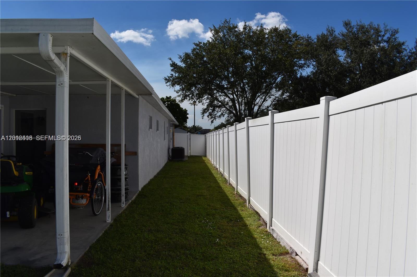 15639 Spring Line Lane Fort Myers, FL 33905 - Photo 12 of 14 a view of a pathway of a house with flower plants in front of main door
