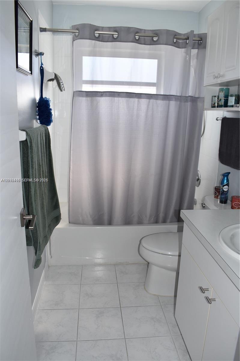 15639 Spring Line Lane Fort Myers, FL 33905 - Photo 3 of 14 a bathroom with a sink a toilet and shower