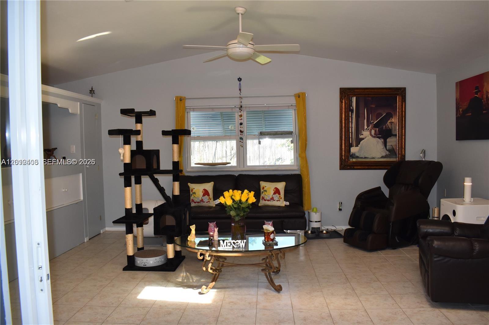 15639 Spring Line Lane Fort Myers, FL 33905 - Photo 5 of 14 a room with gym equipment and windows