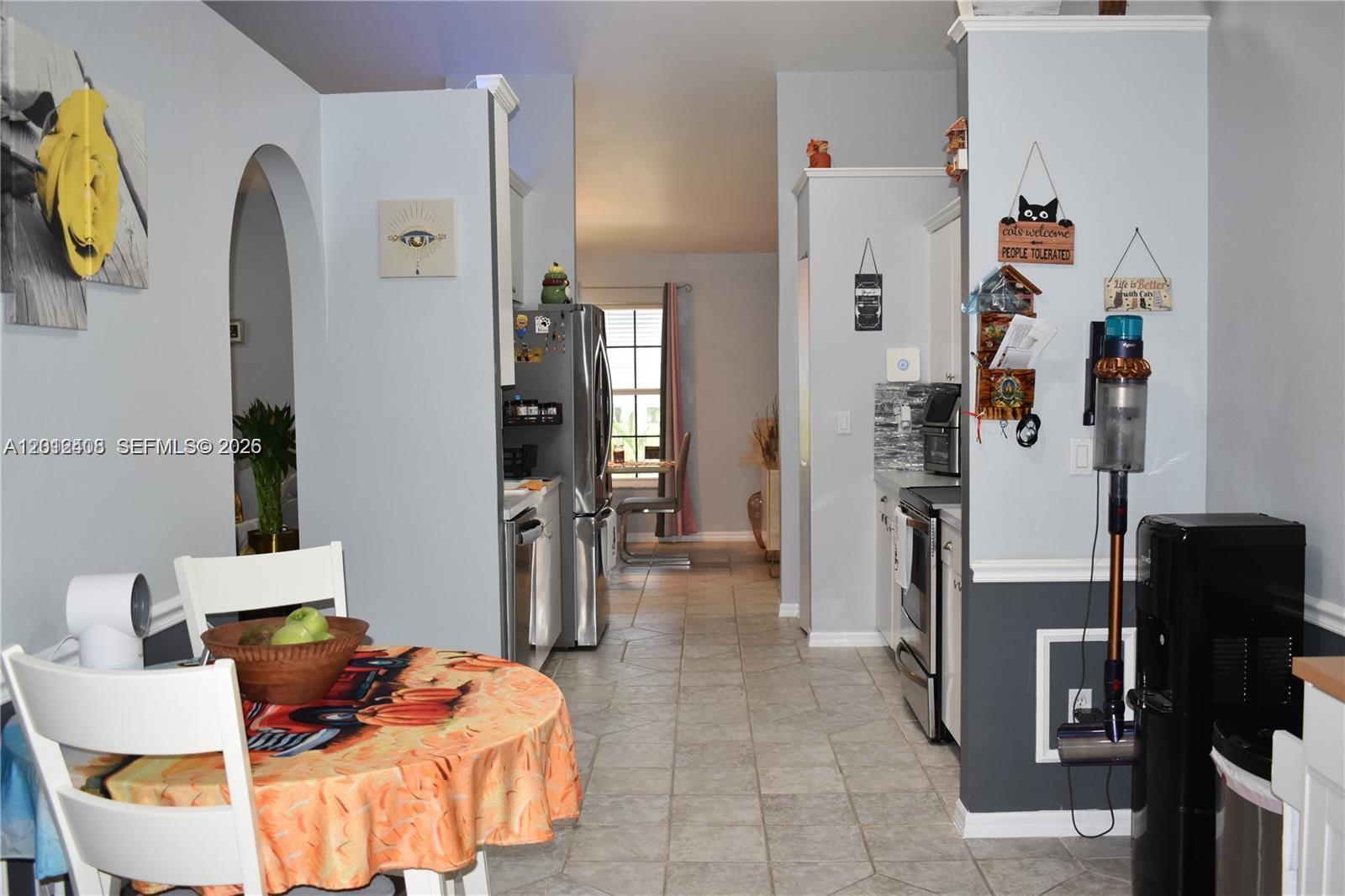 15639 Spring Line Lane Fort Myers, FL 33905 - Photo 6 of 14 a living room with furniture and a bed