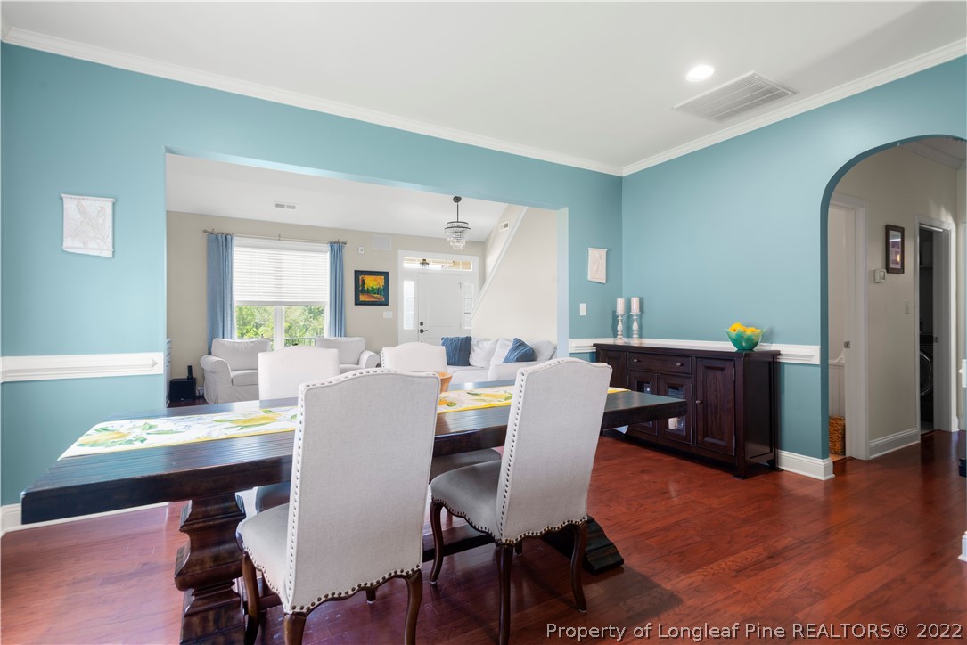 207 Samuel Nicholas Drive Cameron, NC 28326 - Photo 17 of 31 a view of a dining room with furniture and wooden floor