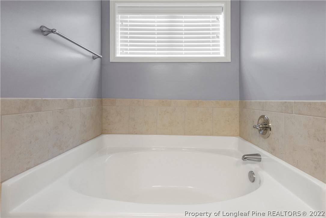 207 Samuel Nicholas Drive Cameron, NC 28326 - Photo 21 of 31 a bathroom with a bathtub