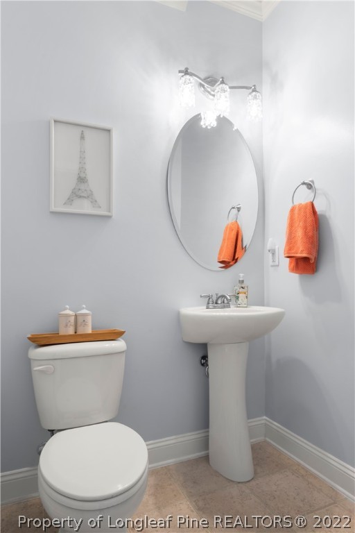 207 Samuel Nicholas Drive Cameron, NC 28326 - Photo 22 of 31 a bathroom with a toilet sink and mirror