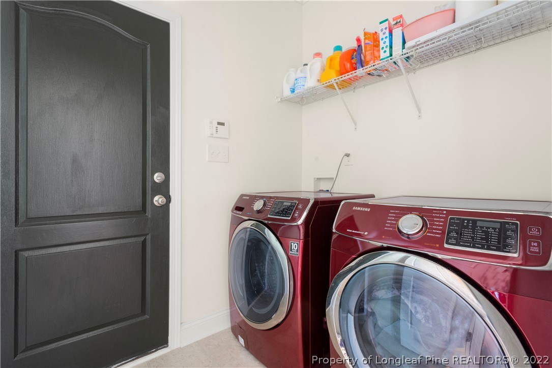 207 Samuel Nicholas Drive Cameron, NC 28326 - Photo 23 of 31 a utility room with dryer and washer
