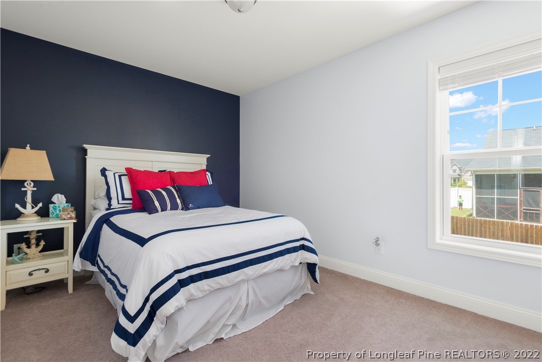207 Samuel Nicholas Drive Cameron, NC 28326 - Photo 24 of 31 a bedroom with a bed and window