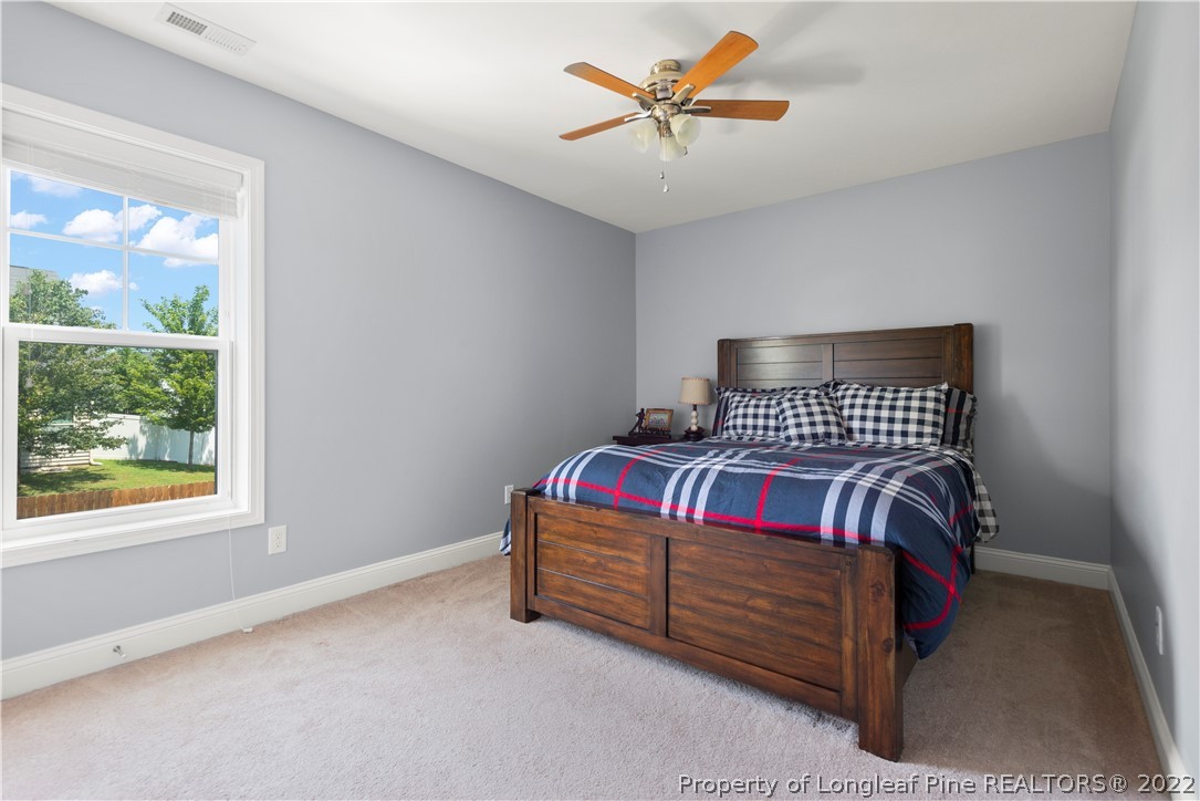 207 Samuel Nicholas Drive Cameron, NC 28326 - Photo 25 of 31 a bedroom with a bed and a window