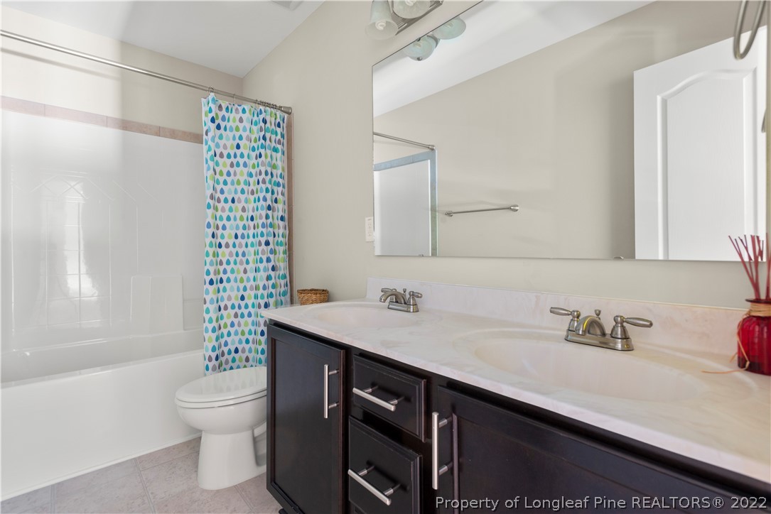 207 Samuel Nicholas Drive Cameron, NC 28326 - Photo 28 of 31 a bathroom with a sink toilet and shower