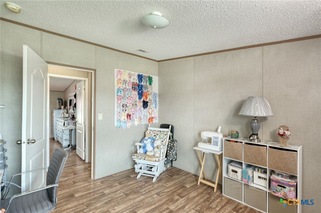 181 Pasadera Drive Elgin, TX 78621 - Photo 23 of 33 a living room with furniture and a window