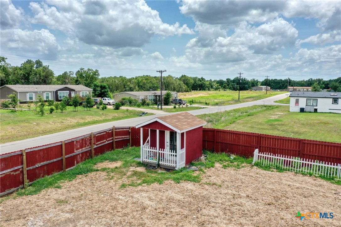 181 Pasadera Drive Elgin, TX 78621 - Photo 30 of 33 a view of a house with a yard
