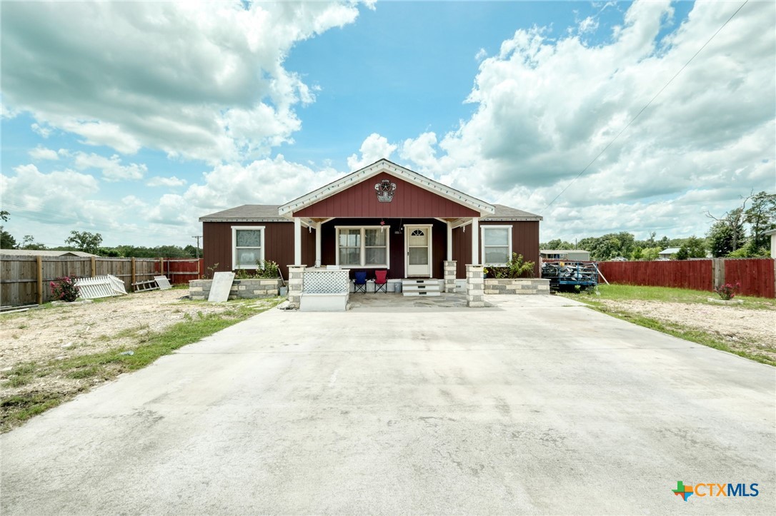 181 Pasadera Drive Elgin, TX 78621 - Photo 3 of 33 a front view of a house with a yard