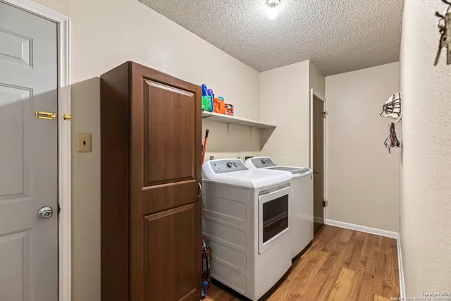 a view of a room with gym equipment and windows