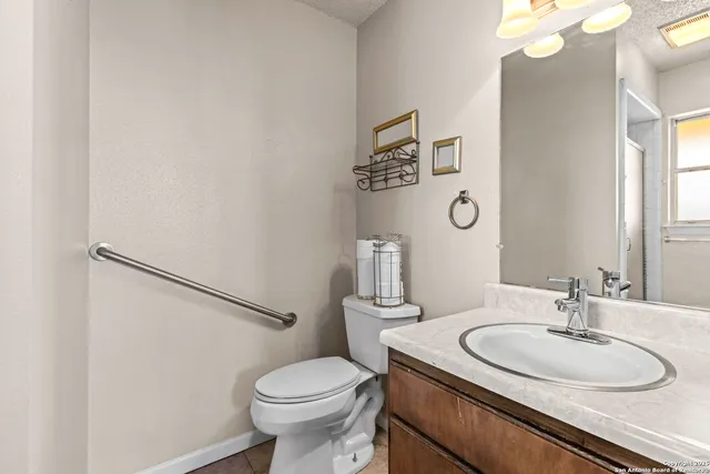 a bathroom with a glass shower door